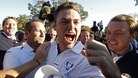 Team Europe golfer Kaymer celebrates winning his match against U.S. golfer Stricker
