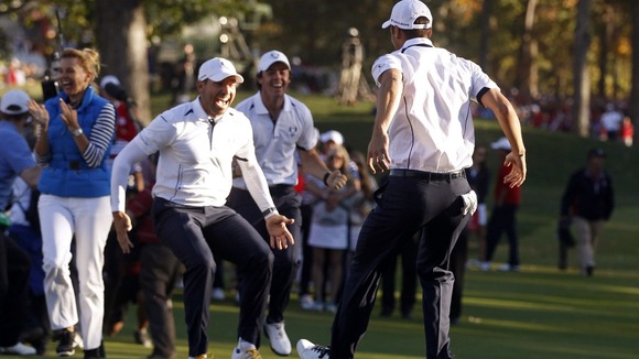 Kaymer celebrates winning his match against U.S. golfer Stricker to retain the Ryder Cup for Europe