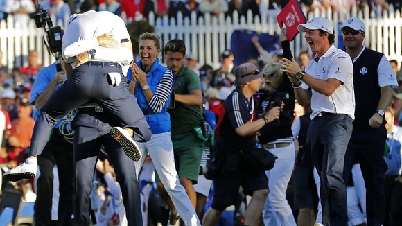 Kaymer celebrates winning his match against U.S. golfer Stricker to retain the Ryder Cup for Europe