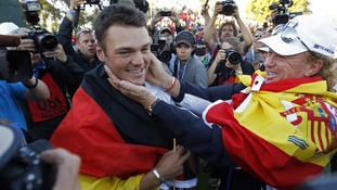 Kaymer celebrates winning his match against U.S. golfer Stricker to retain the Ryder Cup for Europe