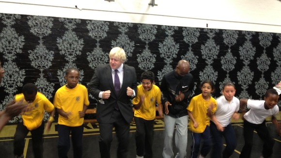 London Mayor Boris Johnson (left) with gold medallist Mo Farah.